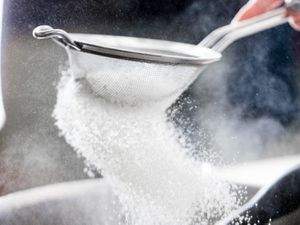 sifting flour into a bowl