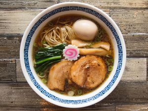 A bowl of shoyu ramen from Ramen Shack on a tabletop.