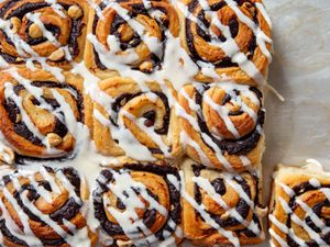 Overhead shot of chocolate hazelnut rolls mascarpone drizzled with glaze