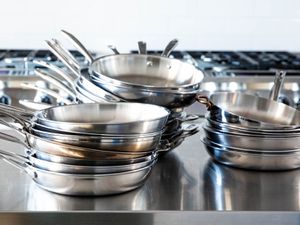 Best stainless steel skillets displayed in stacks on stainless steel counter 