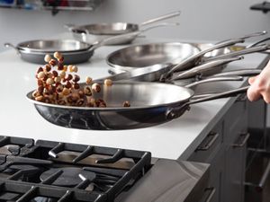 Hazelnuts jump in a skillet as part of a tossing easiness test in our review.