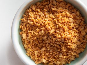 Fried garlic resting in a bowl.