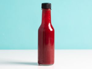 A bottle of Habanero Fermented Hot Sauce With Berries.