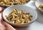 A bowl of creamy pasta with mushrooms 