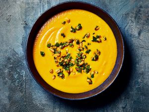 Overhead view of Spicy Carrot Ginger Soup with harissa