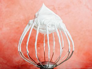 Meringue on pink background