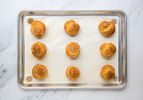 baked choux pastry puffs on a sheet