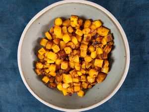 Overhead view of roasted butternut squash in a bowl