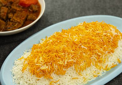 Overhead view of Persian rice on a blue paltter