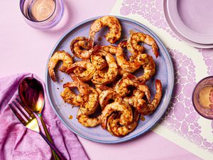 Cajun shrimp on a purple plate.