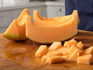 Side angle view of how to cut a cantalope 