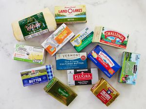 An assortment of salted butters on a white countertop.