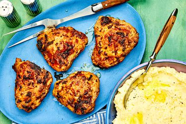 A plate of air-fryer chicken thighs and a side of mashed potatoes