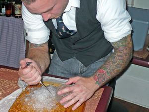 bartender using ice pick