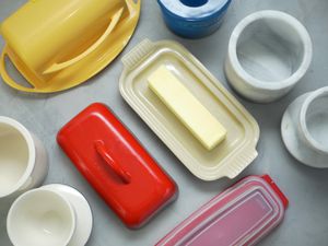 butter dishes and bells on a gray background