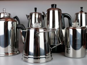 a collection of coffee percolators