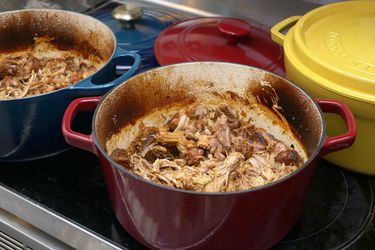 pulled pork in two dutch ovens on the stove