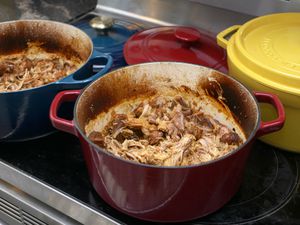 pulled pork in two dutch ovens on the stove