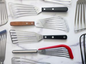 fish spatulas on a marble countertop