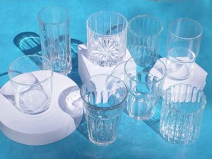 a group of drinking glasses on a blue background