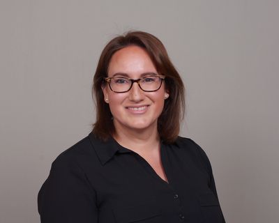 A studio portrait of editor Leah Colins.