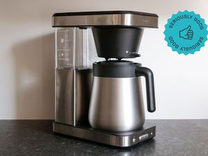 a side angle look at the oxo coffee maker sitting on a grey countertop