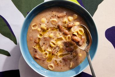 Overhead view of a soup lifting a bite of soup