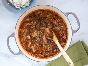 Pork and beans in a Dutch oven.