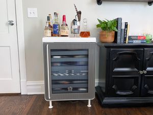 rocco smart fridge with liquor bottles on top