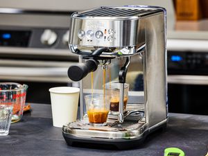 The Breville Bambino Plus Espresso Machine making an espresso