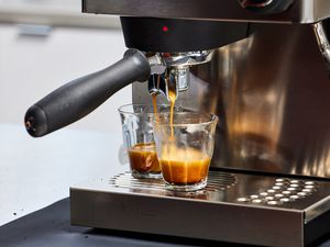 Closeup of the Rancilio Silvia Espresso Machine brewing two espressos into glasses