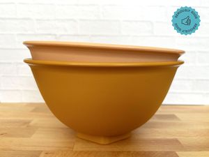 Two stacked mixing bowls on a countertop