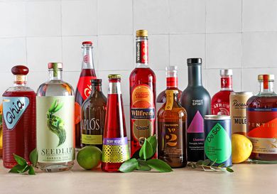 A group of nonalcoholic drinks on a kitchen countertop.