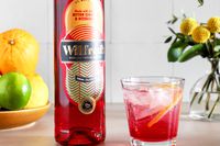 Wilfred's Non-Alcoholic Bittersweet Aperitif in a glass next to bottle