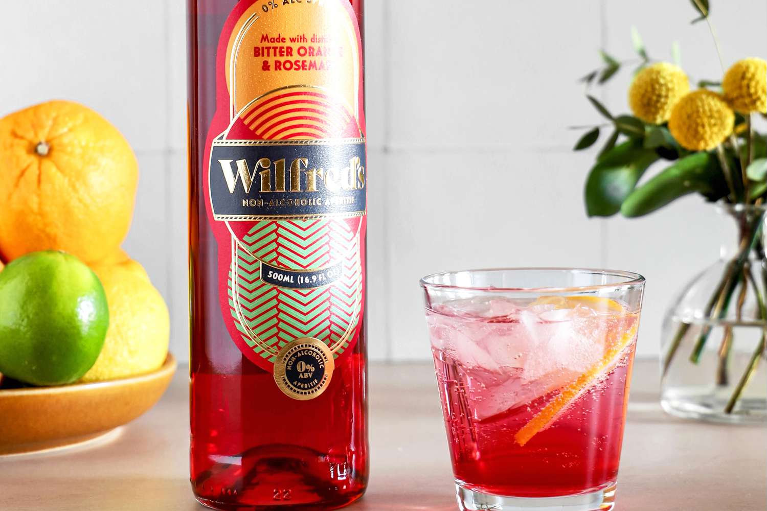 Wilfred's Non-Alcoholic Bittersweet Aperitif in a glass next to bottle