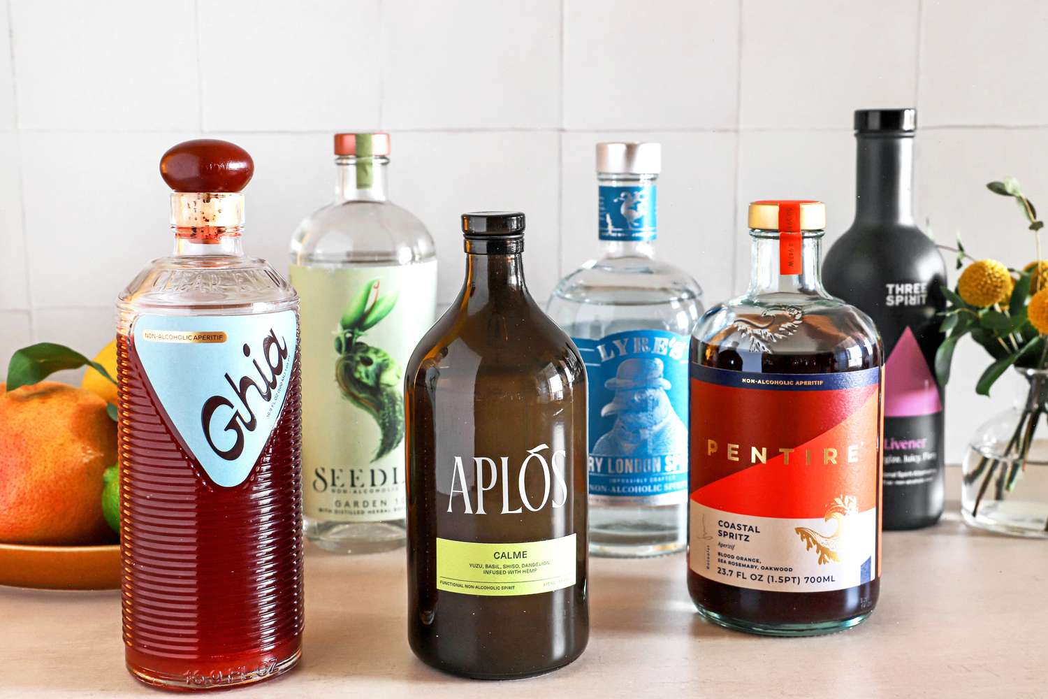 A group of nonalcoholic spirits on a kitchen countertop.