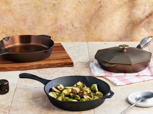 three cast iron skillets on a kitchen countertop