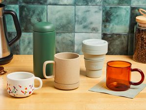 Various coffee mugs on a kitchen countertop.