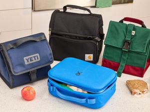 Four lunch boxes on a counter