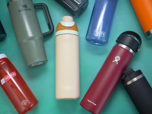 water bottles laying on a green surface