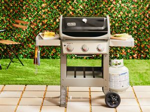 A 3-burner Weber gas grill on a patio