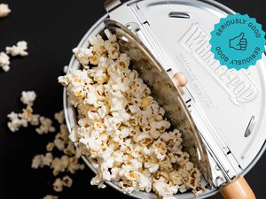 an overhead shot of a Whirley Pop filled with popcorn